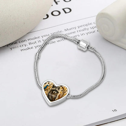 Silver snake chain bracelet with heart pendant showing raccoon artwork and name Rebecca