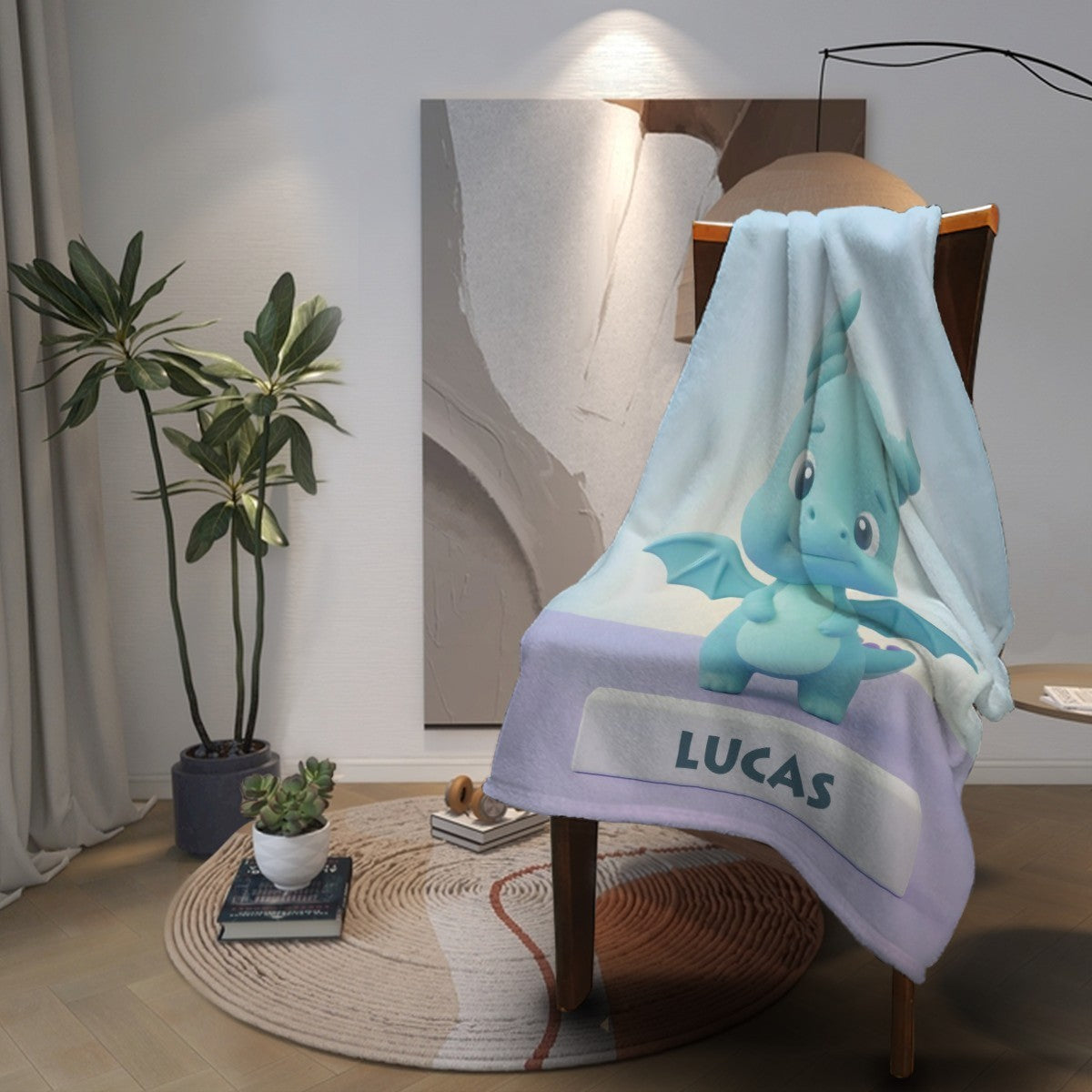 Light blue and lavender kids blanket with blue dragon and “LUCAS” label