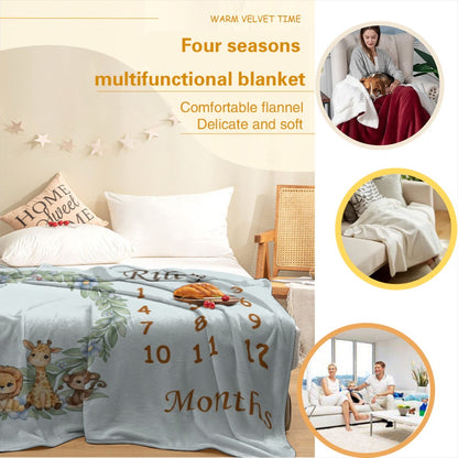 Light blue baby milestone blanket on a bed with animal wreath and month numbers, “Months”