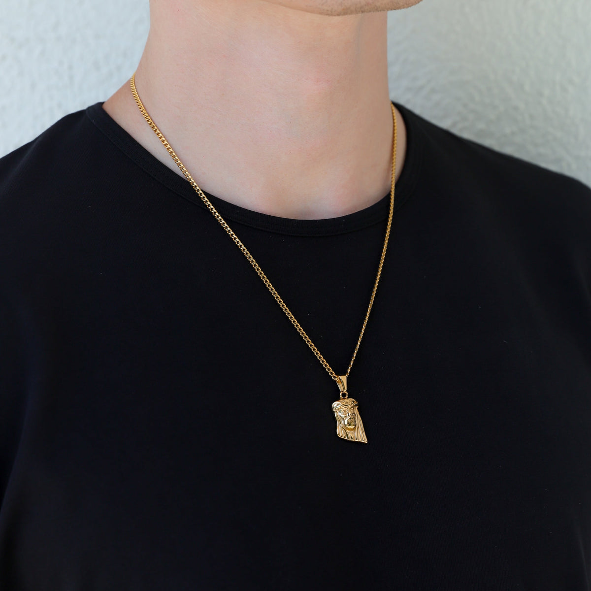 Gold Jesus charm pendant necklace with small portrait detail
