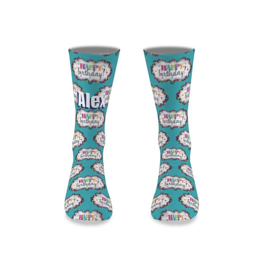 Teal birthday novelty socks with repeating cake and Happy Birthday medallion print