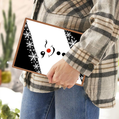 Hand holding snowman A5 notebook with snowflake scarf design and custom name Elena