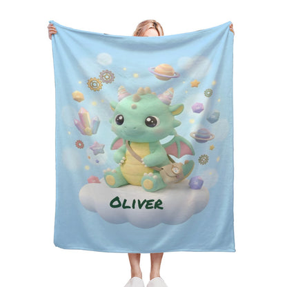 Light blue kids blanket with cute green dragon and Oliver text on a cloud