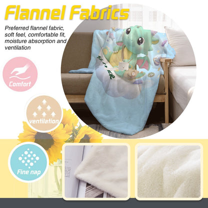 Light blue flannel blanket with green dragon and Oliver cloud motif