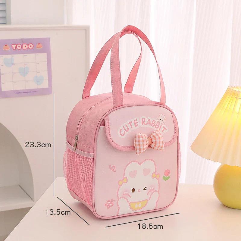 Pink insulated animal lunch bag with bow front pocket and bunny illustration, size diagram shown