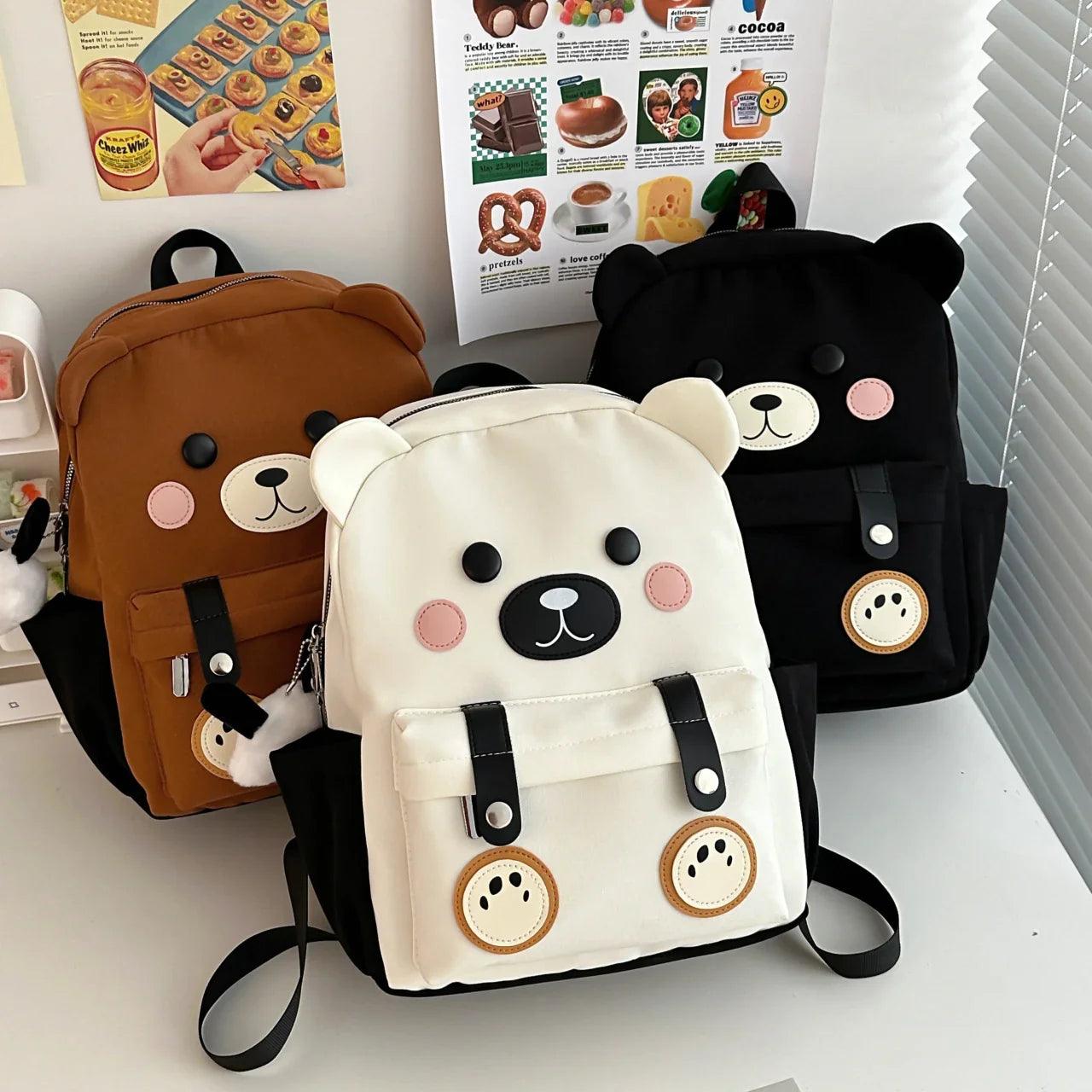 Cute bear backpack set with brown, white, and black mini bags, each with bear-face front