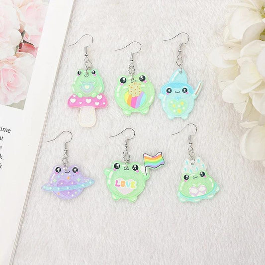 Frog acrylic earrings assortment with dangling frog charms in green, pink, blue, and rainbow colors
