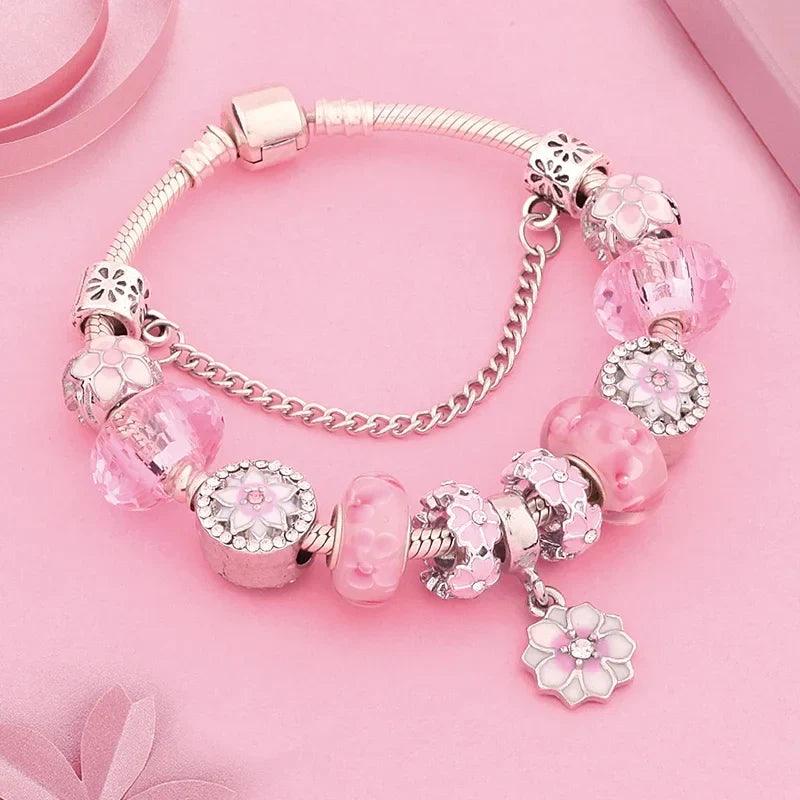 Pink charm bracelet with silver beads, flower and heart charms, hinged clasp