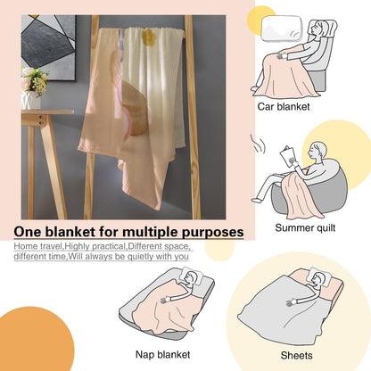 Beige duck character blanket with blue hat and ribbon name badge, shown folded and draped