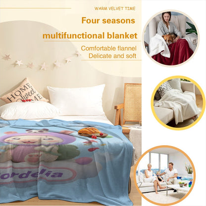 Light blue cartoon blanket with bear character on bed