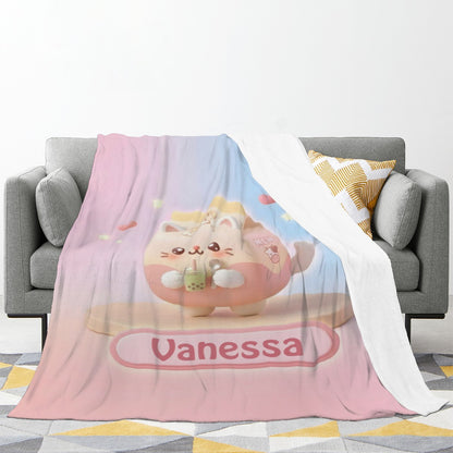 Pastel bunny blanket with pink-and-blue panels and “Vanessa” title, draped over sofa