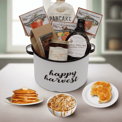 Gift basket with Happy Harvest bucket, pancake mix, syrup, and jam jars