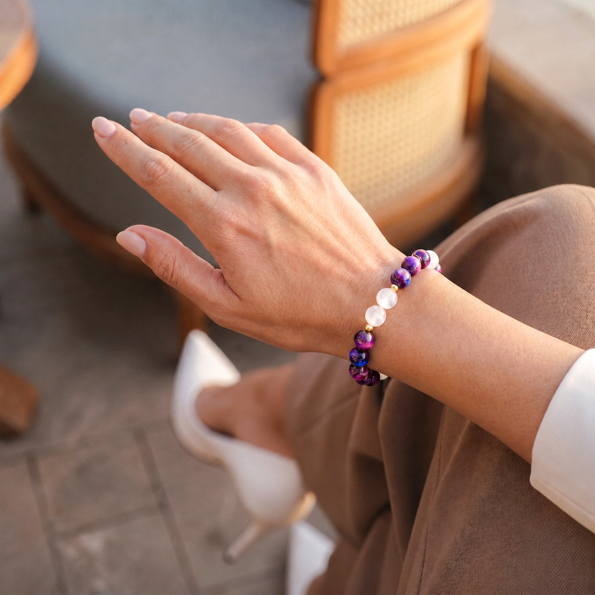 Purple and white beaded bracelet with round faceted beads and elastic stretch cord