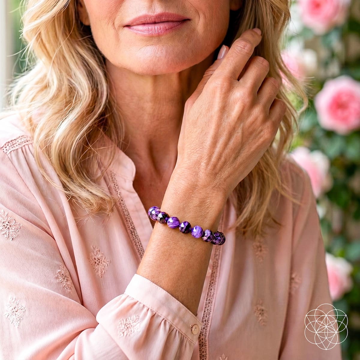 Purple charoite bead bracelet on wrist