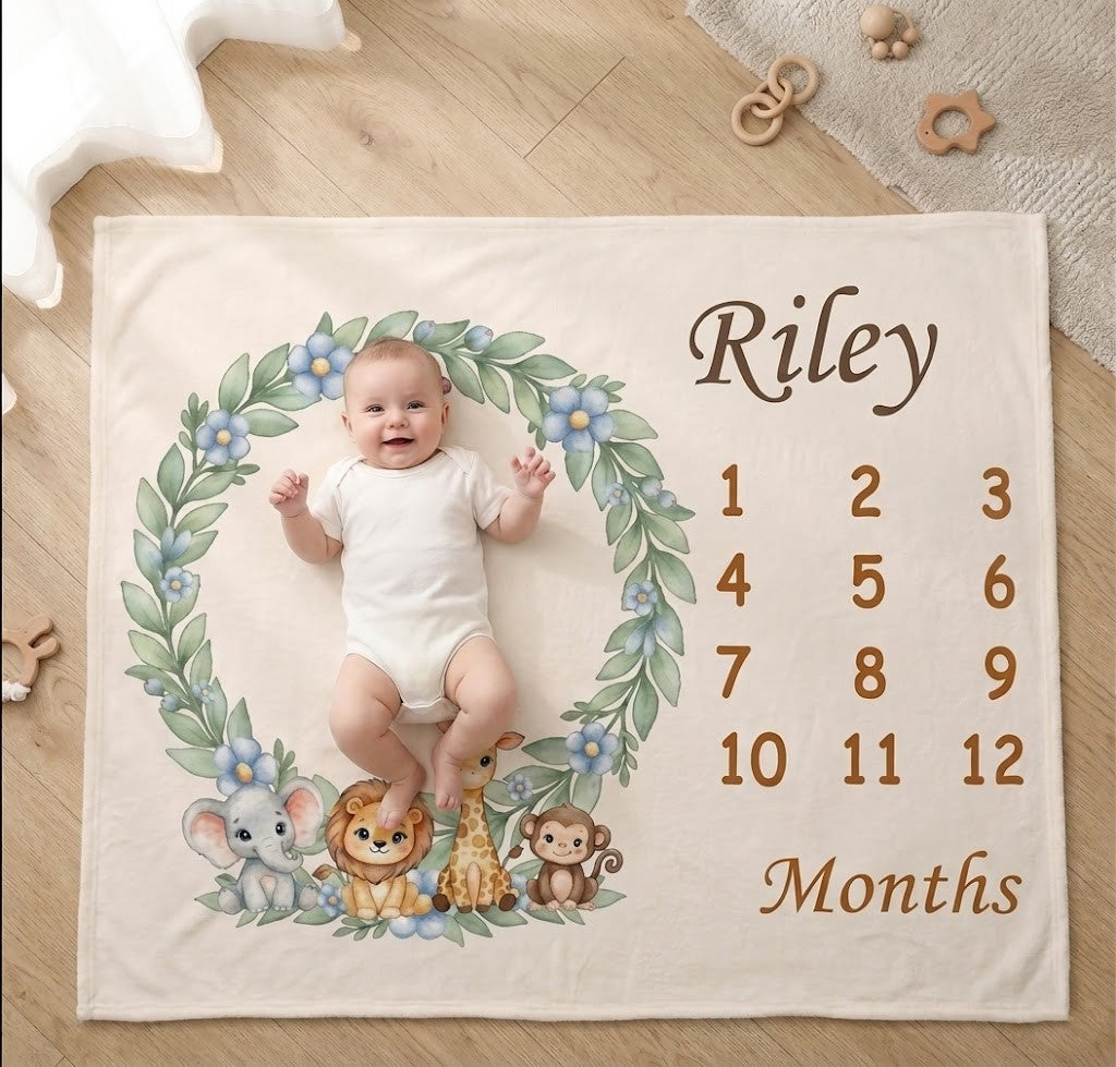 Cream baby milestone blanket with “Riley” and month numbers, animal wreath design