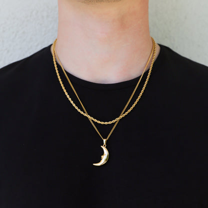 Gold crescent moon pendant necklace with layered chains and moon charm