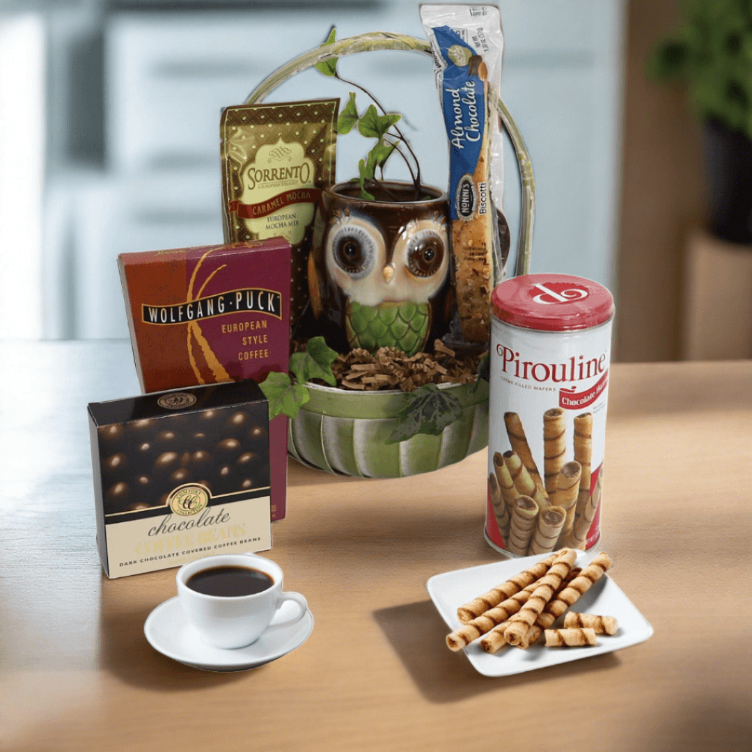 Gift basket with owl figurine, coffee packs, chocolate box, and wafer rolls canister