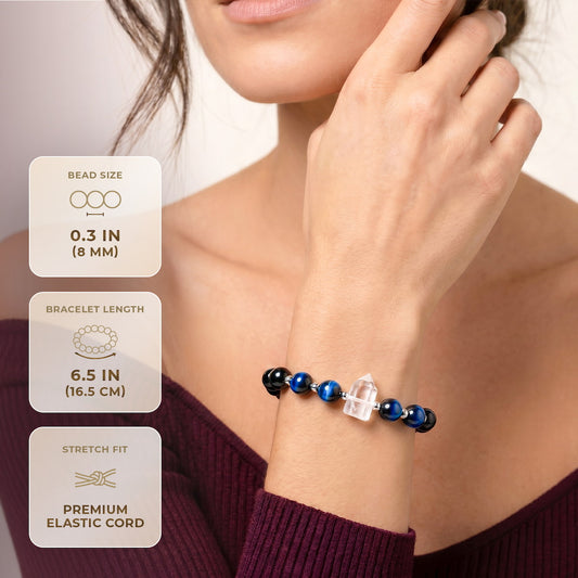Beaded bracelet with dark and blue beads plus clear quartz cube, on wrist