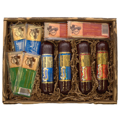 Meat and cheese gift basket with assorted sausages, cheese bars, and crackers inside a box