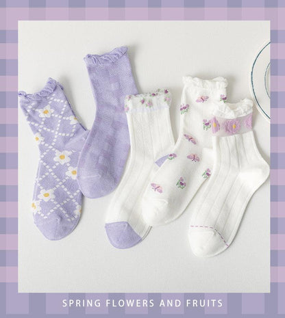 Floral socks set: lavender argyle pair, lavender solid pair, and white floral pairs