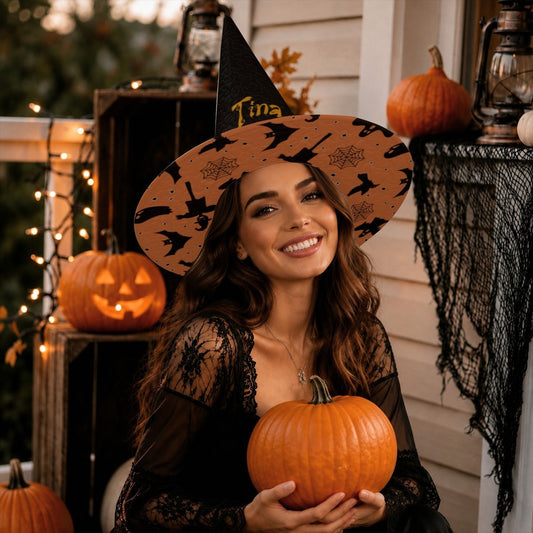 Adult witch costume hat: black pointed top and orange patterned brim with name patch.