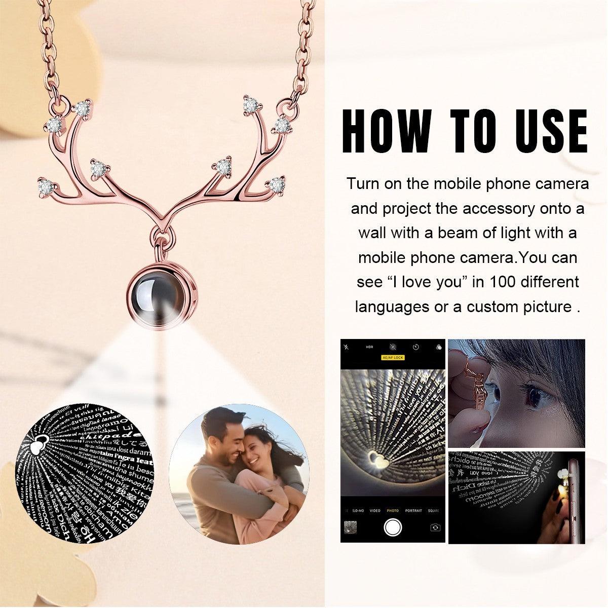 Rose gold antler pendant necklace with round projection locket and crystal details