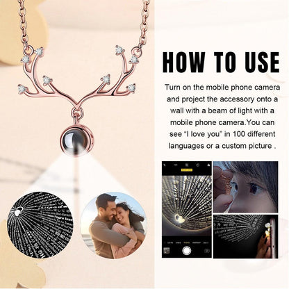 Rose gold antler pendant necklace with round projection locket and crystal details