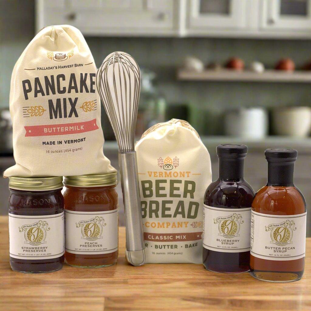 Breakfast gift set with pancake mix pouch, beer bread pouch, whisk, and preserve bottles