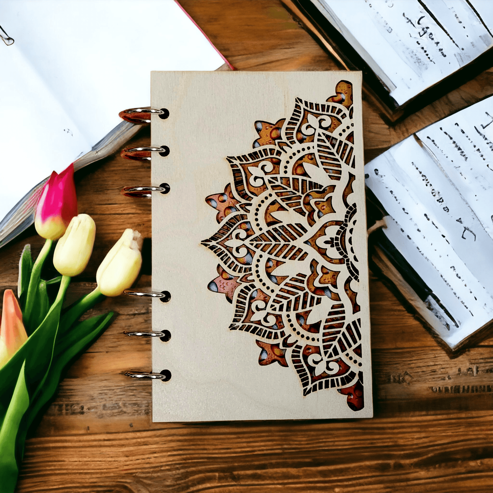 A6 mandala notebook with wood cover, metal rings, and brown ornamental design