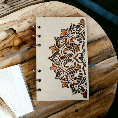 A6 mandala notebook with wood cover, metal rings, and brown ornamental artwork