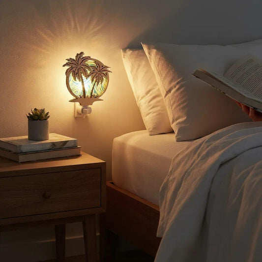 Palm tree LED night light plugged into wall with warm lit palm graphic