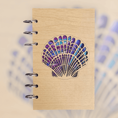 A6 refillable journal on kraft beige with purple seashell cover art and silver binder rings