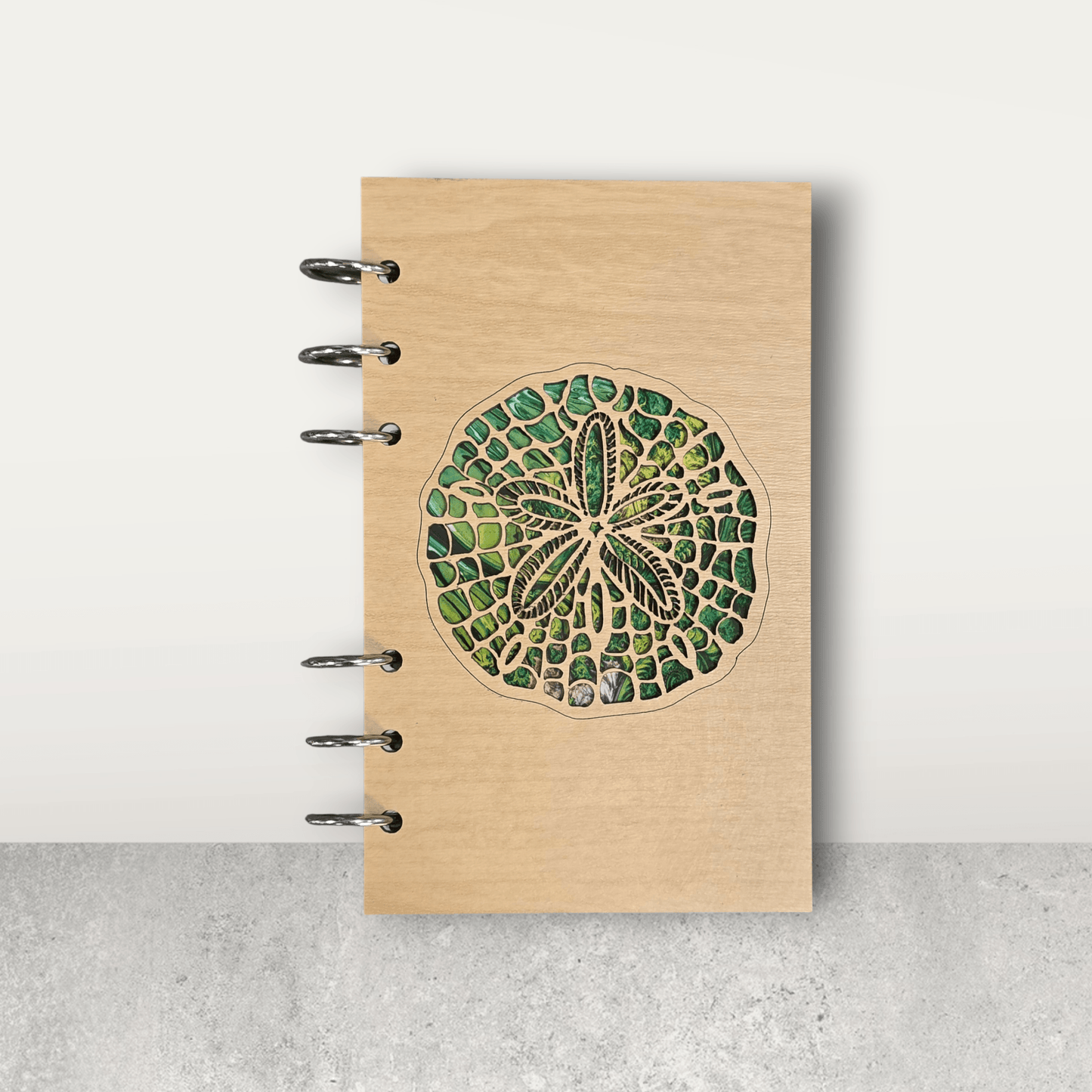 A6 refillable wood notebook journal with sand dollar illustration and five metal binder rings