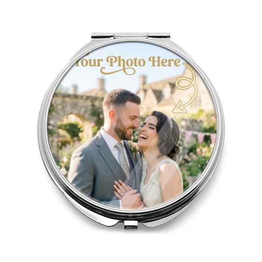 Round silver compact mirror with a custom photo insert on the closed lid