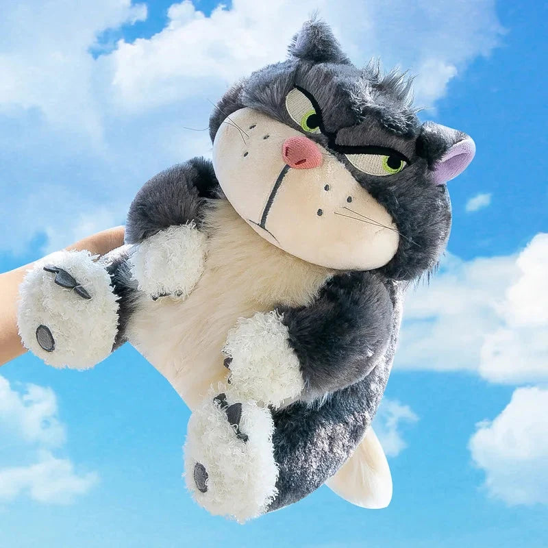 Plush cat doll with green eyes, purple inner ears, white belly and rounded paw pads