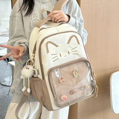 Cream mini cat-ear school backpack with mesh front pocket, cat face patch, and keychain