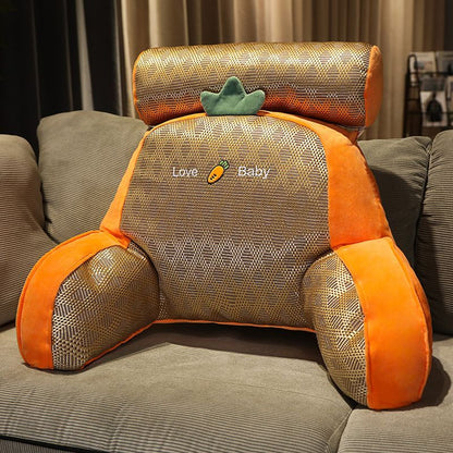 Patterned brown-and-orange plush bear reading pillow with “Love Baby” on backrest