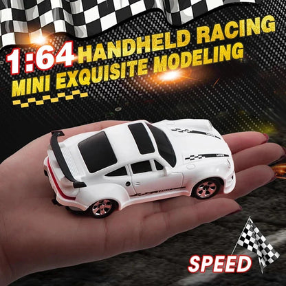 White 1:64 mini RC racing car model with black stripes held in a hand