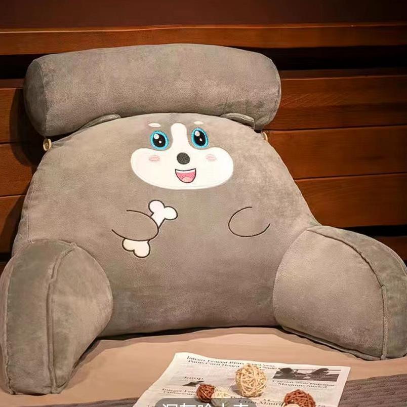 Light gray plush reading pillow with smiling panda face and soft paw details