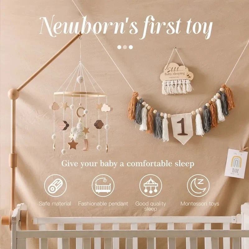 Wooden baby crib mobile with star and moon hanging toys over the crib