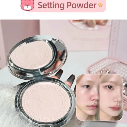 Round setting powder compacts in silver casings with embossed bear design