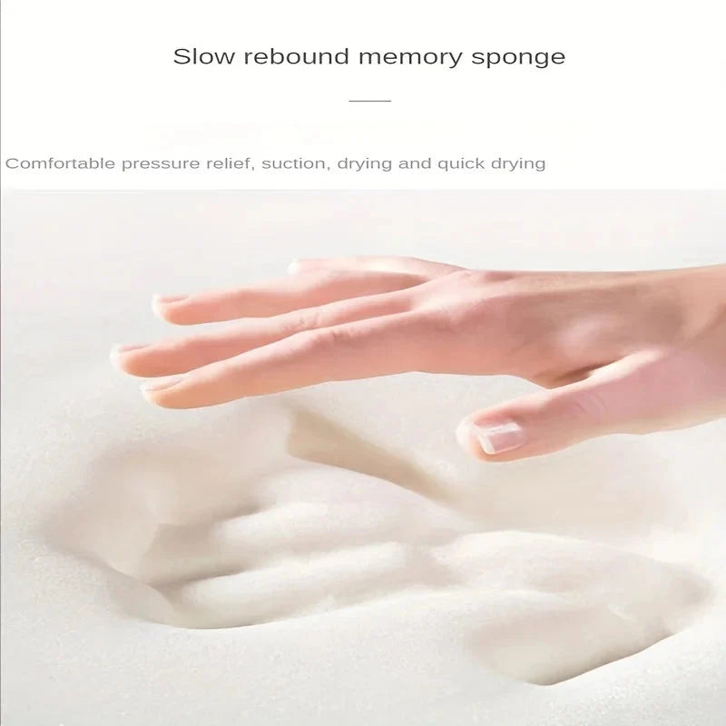 Long-pile absorbent bathroom mat cushioning, hand pressing on absorbent surface