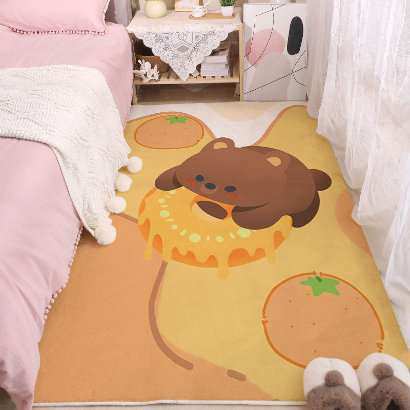 Yellow cartoon puppy area rug with donut slice and smiling character graphic