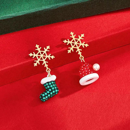 Drop earrings with gold snowflake tops, teal beaded boot dangles, and red bell charm