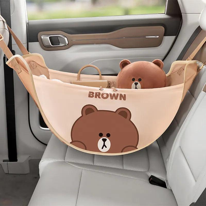 Light brown car seat storage bag with bear face graphic and hanging straps