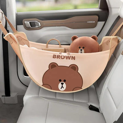 Light brown car seat storage bag with bear face graphic and hanging straps