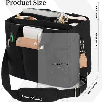 Black canvas organizer tote with front flap pocket, key clip, and adjustable shoulder strap