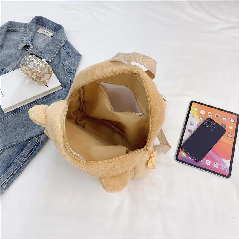 Light tan plush bear backpack open top with beige interior lining and bear-ear hood