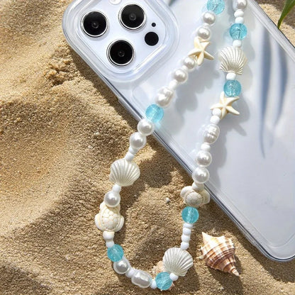 Beaded pearl and blue shell phone charm bracelet with starfish and cowrie accents
