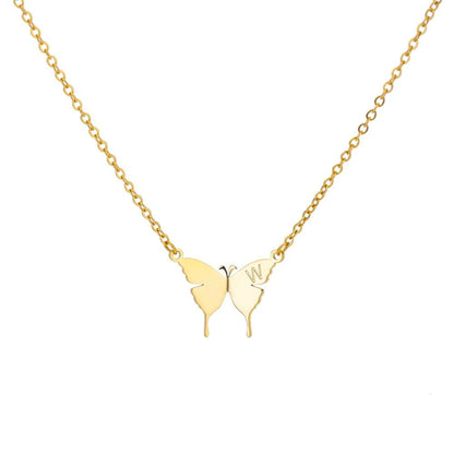 Gold butterfly initial letter necklace with W charm on a chain